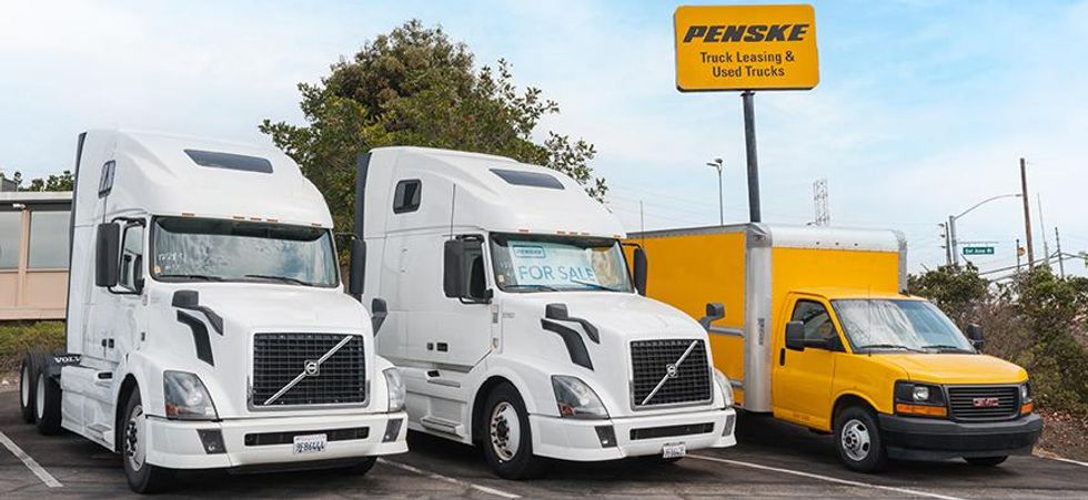 Penske Trucks lined up in a parking lot