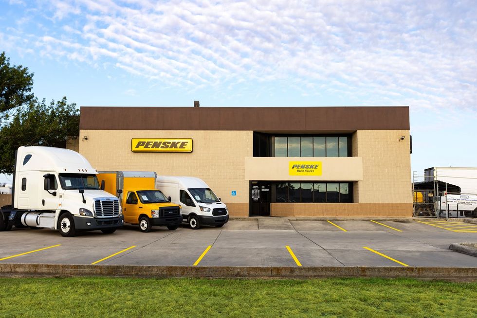 Trucks in a Penske parking lot